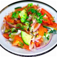 Achik Chuchuk Salad · Tomato, onion and fresh herbs. Vegan. Gluten free.