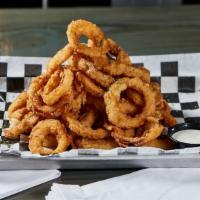 Tower of Tires - Onion Rings · Vegan. Hand battered onion rings served with ranch.