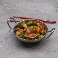 63. Chicken with Broccoli · Served with white rice.