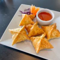 House CRAB RANGOON · House made deep-fried wontons filled with crab and cream cheese served with sweet and sour s...