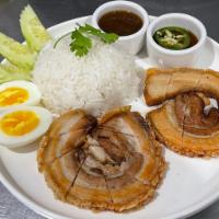 KHAO MOO GRAUB CHA CHU · 
Crispy Pork Belly served with white rice, cucumber,  cilantro, house sauce and boiled egg. 
