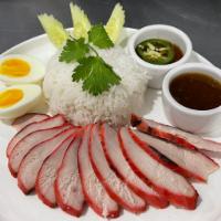 KHAO GAI DANG (Roasted BBQ Chicken) · Red Roasted BBQ Chicken served with rice, bolied egg,  cucumber topped with house sauce and ...