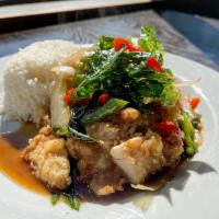 FRIED CHICKEN WITH BASIL SAUCE · Deep-fried chicken topped with basil sauce, bel peppers, yellow onions, basil, garlic, and c...