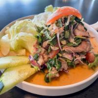 YUM MOO YANG (BBQ Pork Salad) ·  Salad dressing, cilantro, red onion, green onion,  basil, lettuce, garlic. 