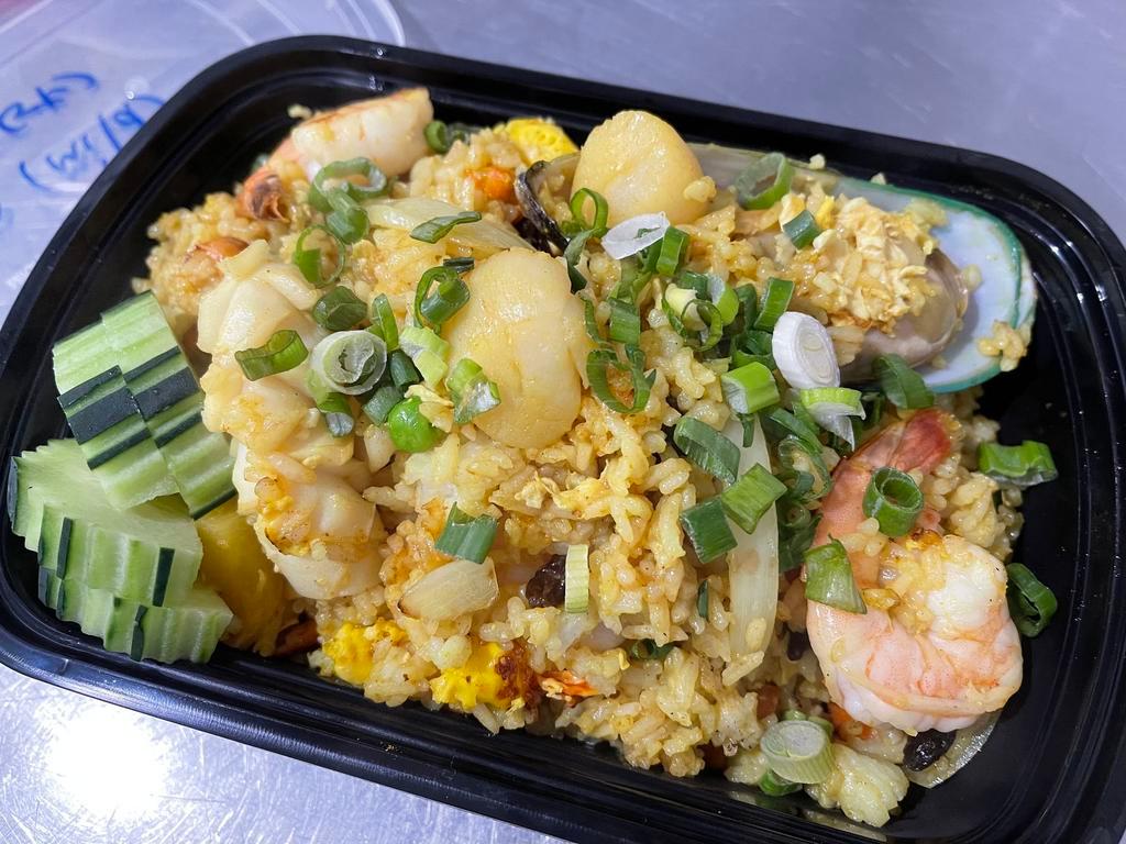 Pineapple Fried Rice · please ask for Gluten-free option. Yellow onion, carrots, peas, pineapple, raisin, egg, garlic, white pepper, cashew nuts, and cucumber.
