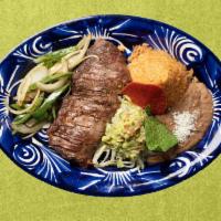 Carne Asada · Grilled skirt steak sauteed jalapeños, onions. Served with guacamole, rice and beans