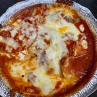 Home Baked Lasagna · Layered pasta with ground beef and ricotta cheese, baked with mozzarella cheese & tomato sau...