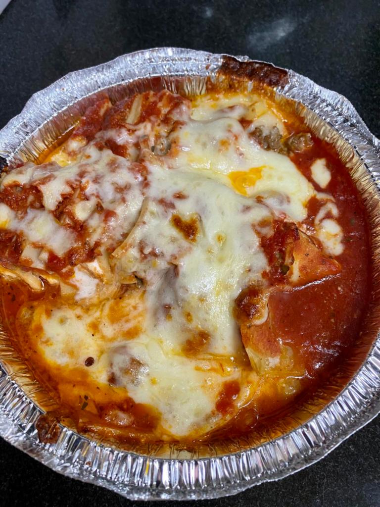 Home Baked Lasagna · Layered pasta with ground beef and ricotta cheese, baked with mozzarella cheese & tomato sauce.