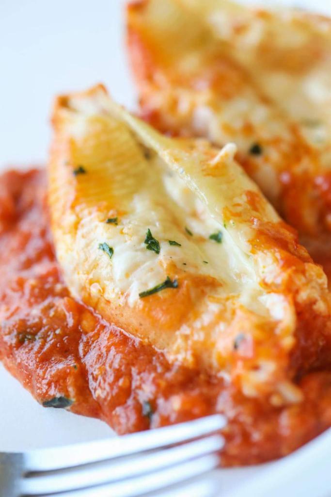 Baked Cheese Stuffed Shells · Pasta shells stuffed with ricotta cheese, baked with tomato sauce and mozzarella cheese.