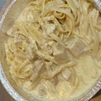 Fettuccine Alfredo · Fettuccine pasta in a creamy Alfredo sauce. Any other toppings can be added for extra. 