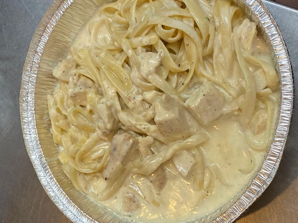 Fettuccine Alfredo · Fettuccine pasta in a creamy Alfredo sauce. Any other toppings can be added for extra. 