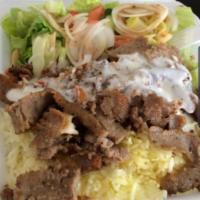 Lamb Over Rice & Veggies ( FREE CAN SODA OR WATER) · Lamb strips over rice and mixed Salad. your choice of sauce. Free can soda or water.