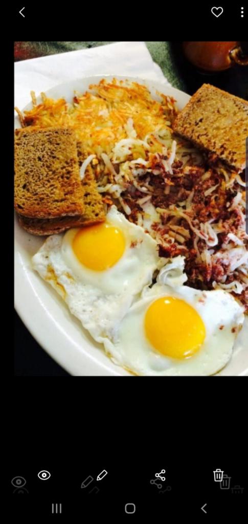 Corned Beef Hash And Eggs Platter · Your choice of eggs. Fried,scrambled, sunny side up,over easy. Corned beef hash, your choice of toast. White,rye,ww,mutigrain,bialy,roll,bagel. Choose your potatoes. Home fries tater tots, hash browns patties. Other types of fried potatoes $1.00 extra.