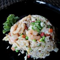 Young Chow Fried Rice · Fried rice served with chicken, pork, and shrimp, peas, carrot, scallion, onion,egg