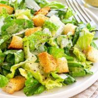 Classic Caesar Salad · Chopped romaine, shaved parmigiano, and croutons tossed in Caesar dressing.