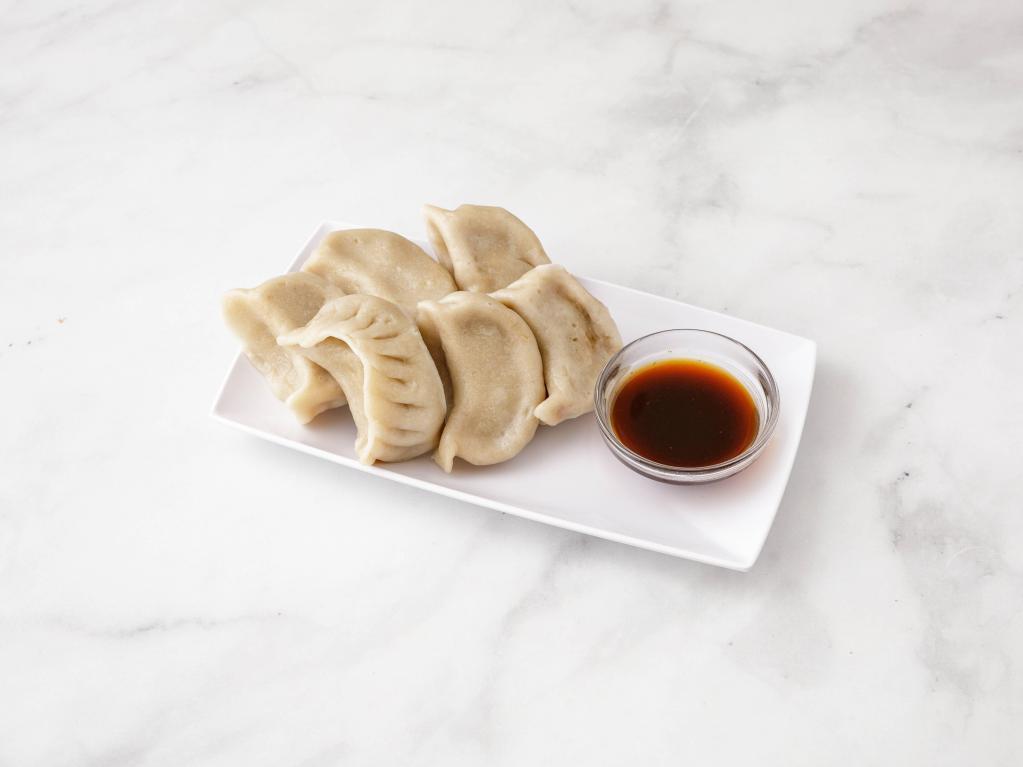 11. Steamed Dumplings · With special sauce. 8 pieces.