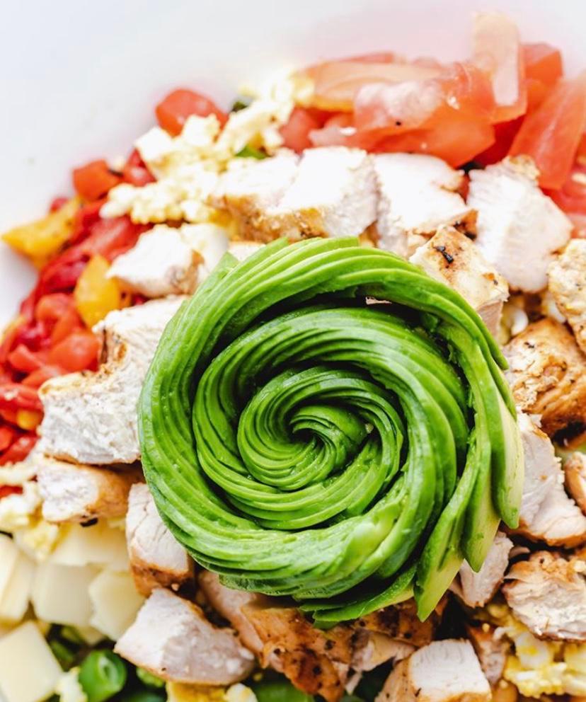 Forty Carrots Chopped Salad · Baby field greens, grilled chicken, avocado, roasted red and yellow peppers, Swiss cheese, chickpeas, tomatoes, cucumbers, green beans, hard-boiled egg and our signature grilled onion balsamic vinaigrette.