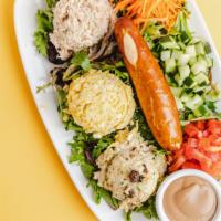 Flagship Trio Platter · A scoop each of our 3 favorite salads – classic tuna, sonoma chicken and egg salad - on a be...
