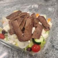 Gyro Salad · Lettuce, tomatoes, carrots, cucumbers, onions, Kalamata olives, sliced beef and lamb, feta c...