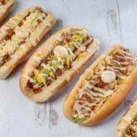 Sencillo Dog · Hot dog, mozzarella cheese, minced potato chips, sauce, and quail egg.
