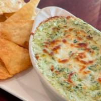 Spinach & Artichoke Dip · housemade creamy dip with housemade tortilla chips
