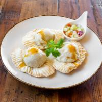 Golden Curry Puff · Baked puff pastry stuffed with ground chicken, sweet potato, carrot, red onion and curry pow...