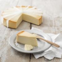 New York Cheese Cake (Slice) · Traditional New York cheesecake flavored with a hint of vanilla, on a sponge cake base.
