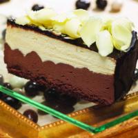 3 Chocolate Mousse (Slice) · White and dark chocolate mousse on a sponge base, coated with a chocolate hazelnut glaze and...