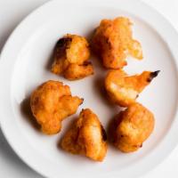 ESO Side Crispy Buffalo Cauliflower Bites · Cauliflower battered with Aleppo pepper and buffalo-style hot sauce. Served with ranch for d...