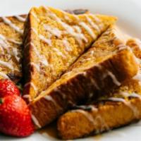 Cinnamon Swirl French Toast · Homestyle french toast swirled with our house made cinnamon brown sugar sauce. Topped with v...