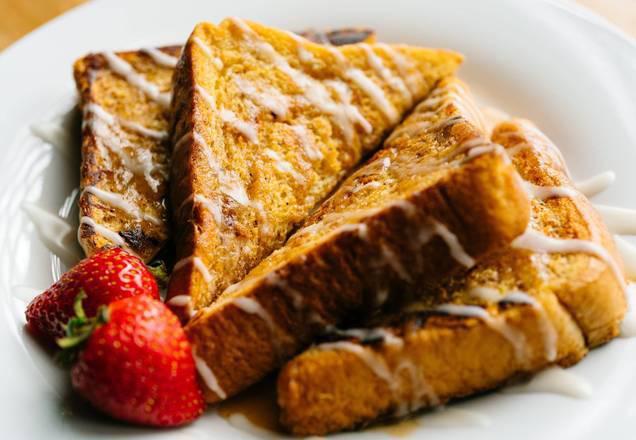 Cinnamon Swirl French Toast · Homestyle french toast swirled with our house made cinnamon brown sugar sauce. Topped with vanilla glaze. Served with maple syrup.