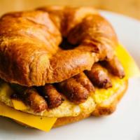 Sausage, Egg, and Cheese Croissant · Flaky buttery croissant served with 2 fresh cracked eggs, choice of cheese and pork sausage ...