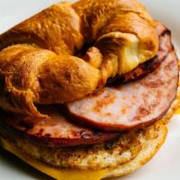 Ham, Egg, and Cheese Croissant · Flaky buttery croissant served with 2 fresh cracked eggs and layers of black forest ham.