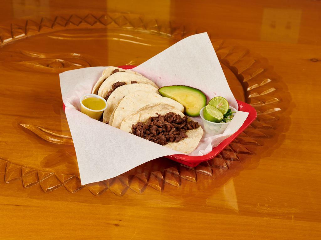 Tacos · Corn tortilla soft tacos. Includes green and red salsa 