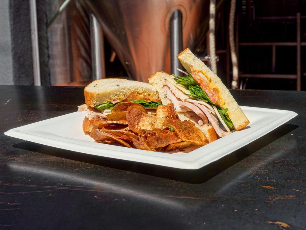 Jailbird Box Lunch · Slow-smoked turkey with Swiss cheese, thinly sliced Roma tomatoes, spinach, arugula, red onions and our deadbeach hefeweizen mustard on hearty wheat bread.