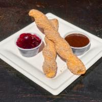 Papi Churro · Deep-fried cinnamon sugar churro served with a side of our smoked grape IPA jelly and our Ab...