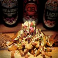 Cry Baby Fries · A large portion of our crispy handcut fries smothered with our beer cheese topped with loads...