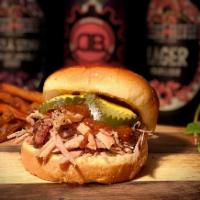 Porky and Bess Sandwich · Smokey pulled pork on a brioche bun, doused with our chipotle stout BBQ sauce, finished with...