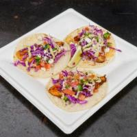 3 It's Raining Fish Tacos · A blackened tilapia filet, garnished with red cabbage, fresh pico de gallo, queso fresco, a ...