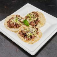 3 It's Raining Brisket Tacos · Slow-smoked brisket topped with queso fresco, green onions and out poblano cream sauce.