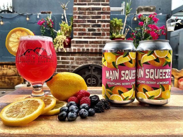 Main Squeeze · Main squeeze is a triple berry lemonade made from scratch with real blueberries, raspberries and blackberries with a beautiful sparkling finish.