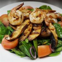 Shrimp Spinach Salad · Grilled shrimp served over baby spinach, portobello mushrooms, tomatoes and onions with choi...