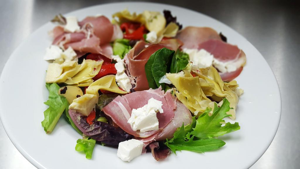Tuscan Salad · Mixed greens, roasted red peppers, fresh mozzarella, artichokes, prosciutto and balsamic vinegar dressing.