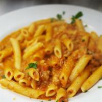 Penne Bolognese · Traditional meat sauce.