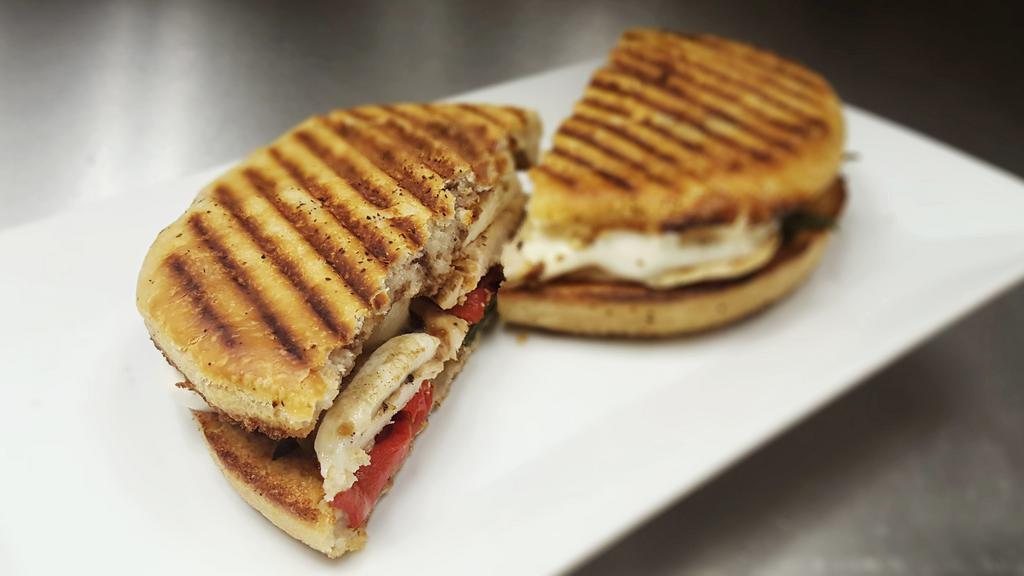 Boston Chicken Panini · Grilled chicken, roasted red peppers, fresh mozzarella, basil and balsamic vinegar.