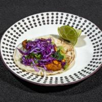 Shrimp Tacos  · Fried and battered shrimp served on 3 corn tortillas and topped with red cabbage, chipotle v...