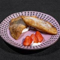 Strawberry Empanada · Single handmade sweet empanada filled with strawberry compote and tossed in cinnamon sugar.