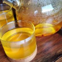 Turmeric tea pot 32oz · Fresh turmeric tea, ginger, honey, lime, cinnamon, pink peppercorns