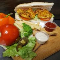 Grilled Chicken Sandwich · Lettuce, Tomato, Mayonnaise, Ketchup and a small bag of French Fries