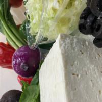 Greek Salad ·  Feta cheese, tomatoes, red onions, Kalamata olives, cucumbers, peppers, and crispy lettuce.